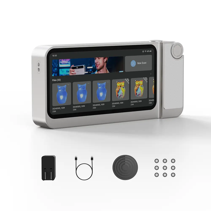 Toucan 3D Scanner, a compact handheld device with a touchscreen showing a scanning app. Includes power adapter, USB-C cable, turntable mat, adhesive markers. Available at 3DMakerPro.